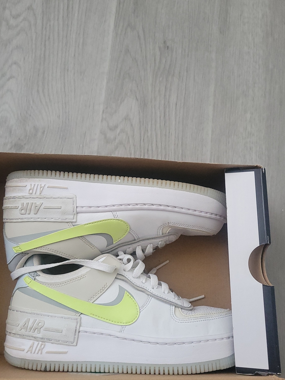 ' White Sneaker with Volt Swoosh